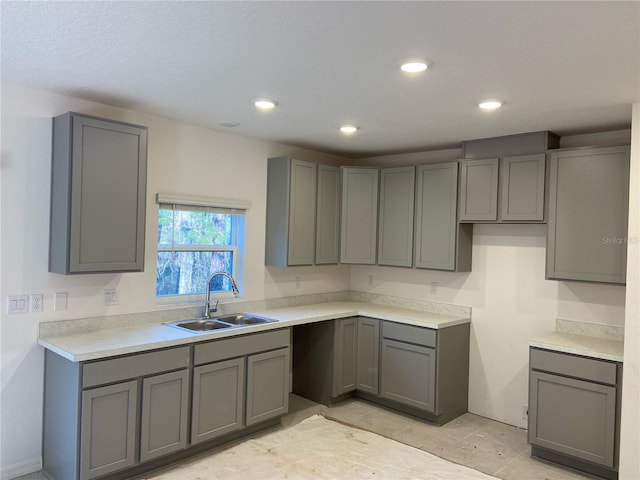 kitchen with sink and gray cabinetry