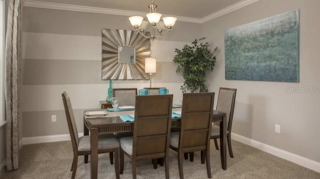 dining area featuring ornamental molding, carpet, and a chandelier