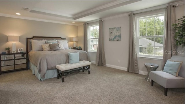 bedroom with crown molding, light colored carpet, and a raised ceiling