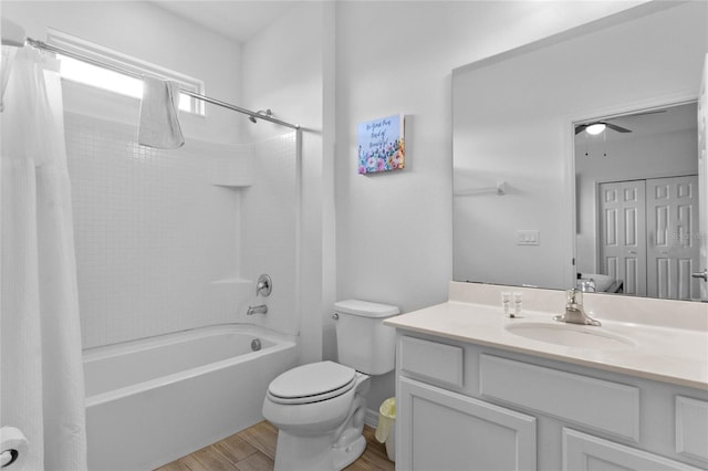 full bathroom featuring shower / tub combo, toilet, vanity, and wood-type flooring