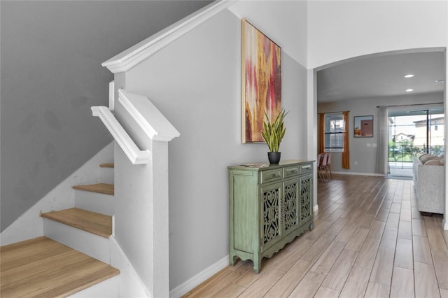 stairs featuring light hardwood / wood-style flooring