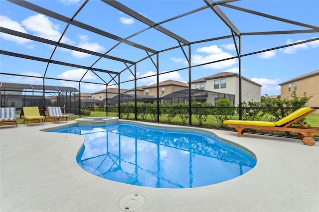 view of swimming pool with an in ground hot tub, a patio, and a lanai