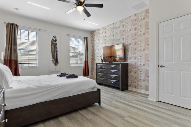 bedroom featuring ceiling fan and light wood-type flooring