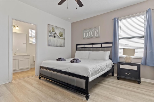 bedroom featuring ensuite bathroom, light hardwood / wood-style floors, and ceiling fan