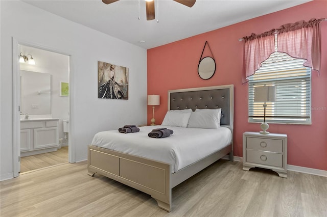 bedroom with sink, ceiling fan, ensuite bathroom, and light hardwood / wood-style flooring