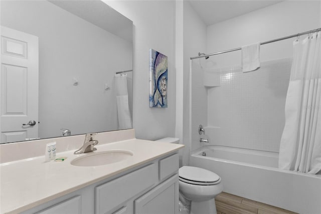 full bathroom with vanity, wood-type flooring, toilet, and shower / bathtub combination with curtain