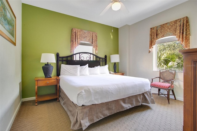 bedroom with ceiling fan and carpet flooring