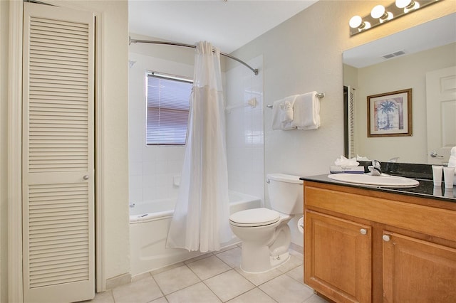 full bathroom with tile patterned floors, shower / bath combo, toilet, and vanity