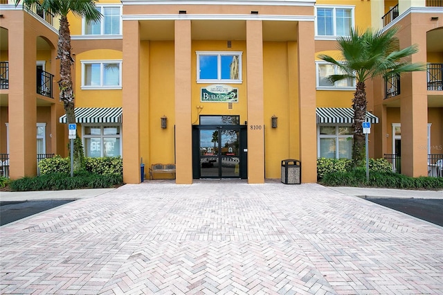 8100 Poinciana Blvd Unit 2212, Orlando, FL 32821 - view of exterior entry with stucco siding and french doors