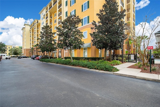 8100 Poinciana Blvd Unit 2212, Orlando, FL 32821 - view of apartment building / complex with fence