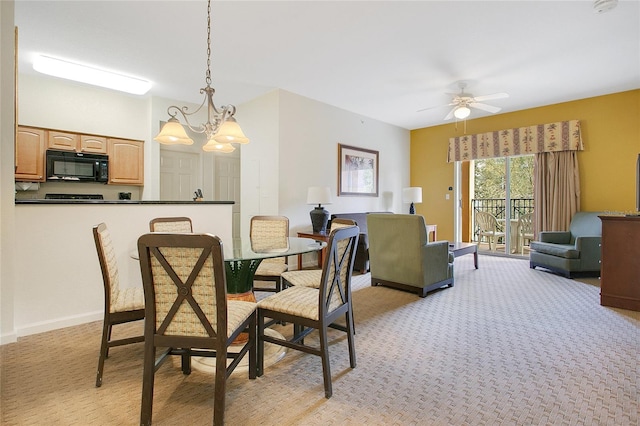 8100 Poinciana Blvd Unit 2212, Orlando, FL 32821 - dining space featuring a chandelier, light colored carpet, and a ceiling fan