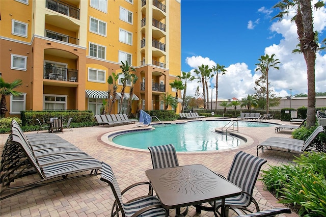 8100 Poinciana Blvd Unit 2212, Orlando, FL 32821 - community pool featuring a patio area