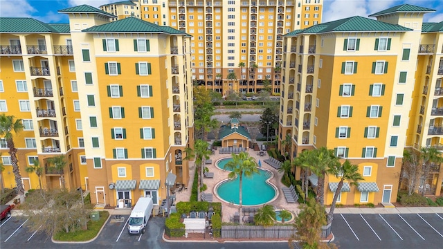 view of building exterior with a community pool