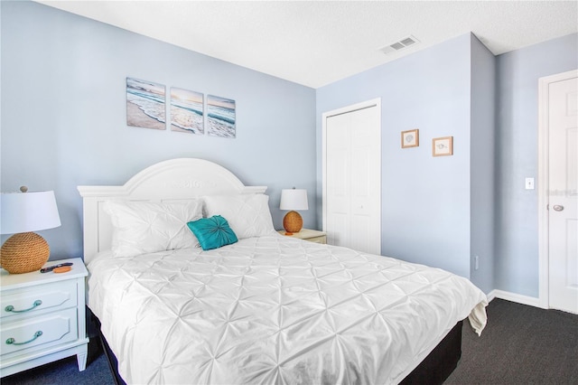 carpeted bedroom with a closet