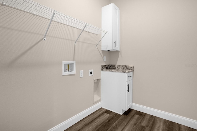 clothes washing area featuring washer hookup, cabinets, electric dryer hookup, and dark wood-type flooring