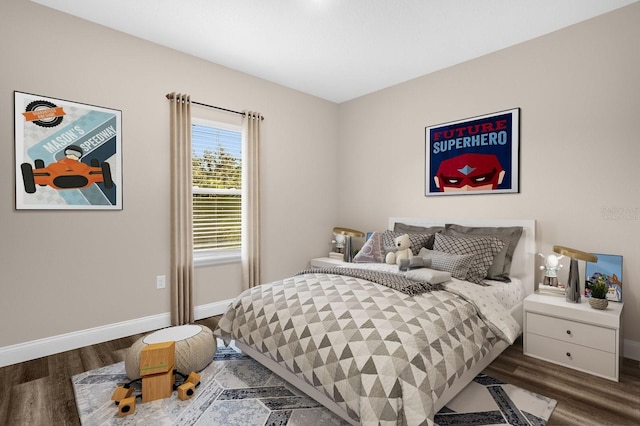 bedroom with dark wood-type flooring