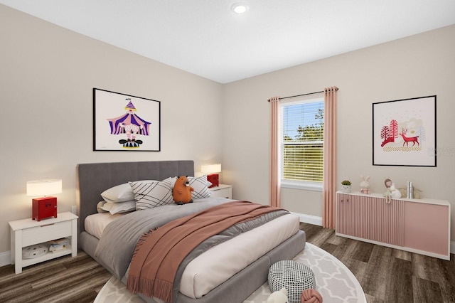 bedroom with dark wood-type flooring