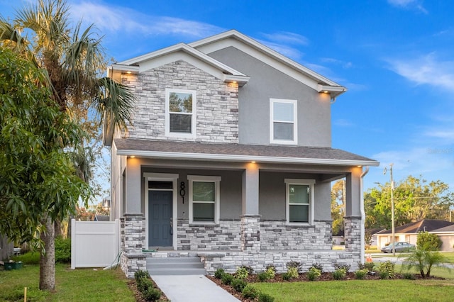 view of front of home featuring a front lawn and a porch