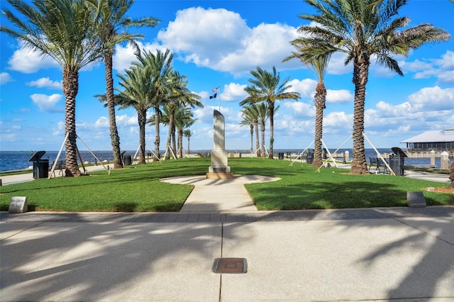 view of nearby features featuring a lawn and a water view