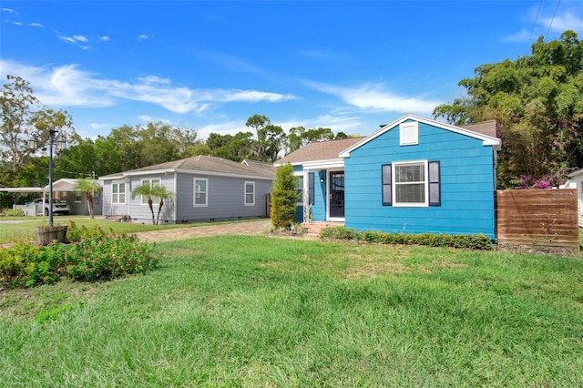 ranch-style house with a front yard