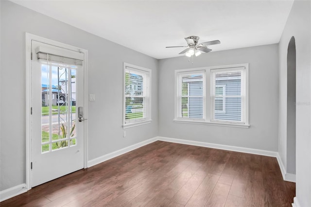 spare room with ceiling fan and dark hardwood / wood-style flooring