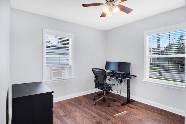 home office with dark hardwood / wood-style flooring, ceiling fan, and a healthy amount of sunlight