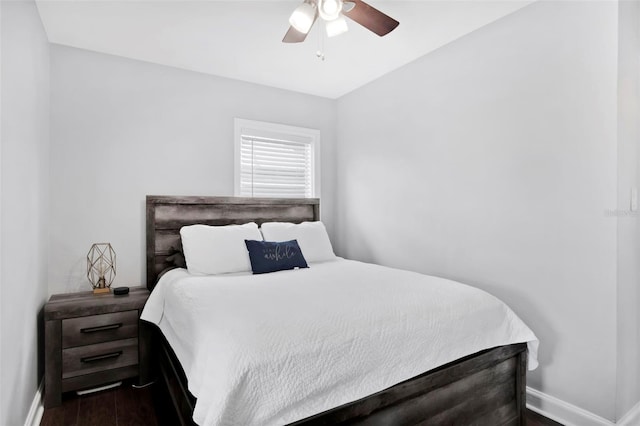 bedroom featuring ceiling fan and dark hardwood / wood-style flooring