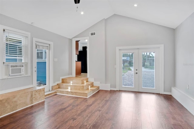 interior space featuring high vaulted ceiling, dark hardwood / wood-style floors, ceiling fan, and french doors