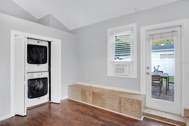 interior space with vaulted ceiling, stacked washer / dryer, and dark hardwood / wood-style flooring