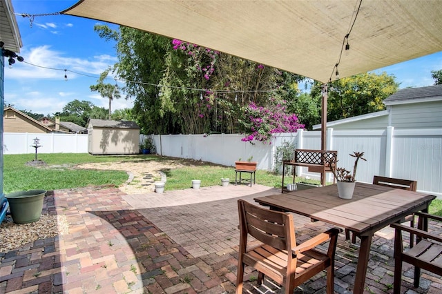 view of patio / terrace with a storage unit