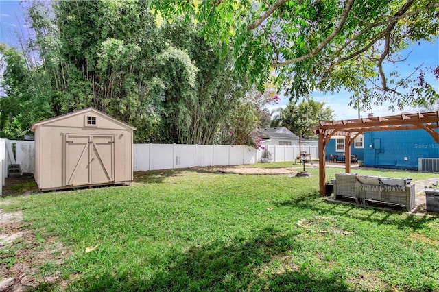 view of yard with a storage unit, a pergola, and central AC