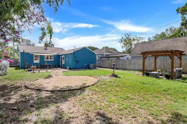 view of yard featuring a pergola, a patio, and central AC unit