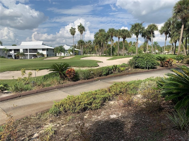 view of property's community with a lawn