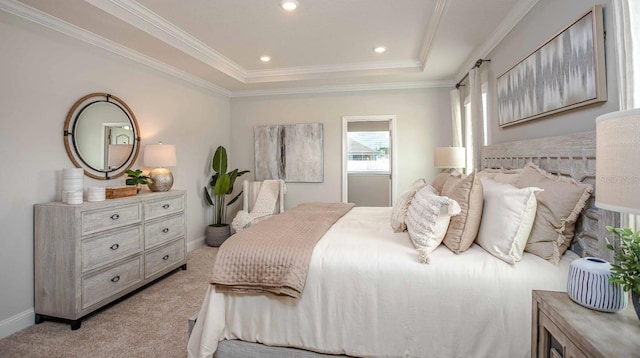 bedroom with crown molding, a raised ceiling, and light carpet