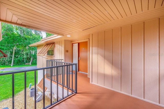 exterior space featuring central AC and a yard