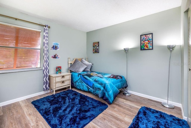 bedroom featuring wood-type flooring