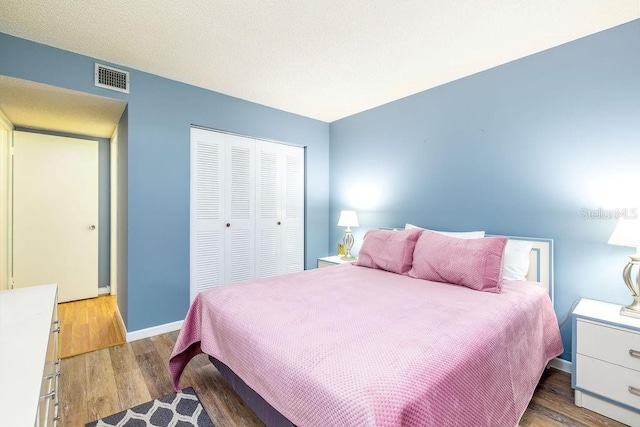 bedroom featuring a closet and hardwood / wood-style floors