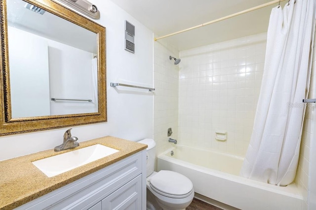 full bathroom featuring shower / bath combo, toilet, and vanity