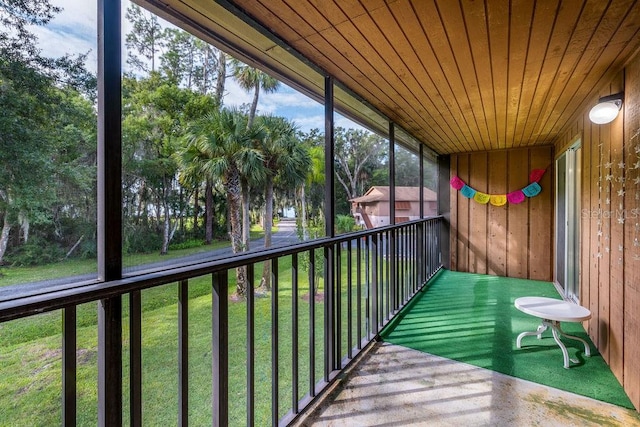 unfurnished sunroom featuring wood ceiling