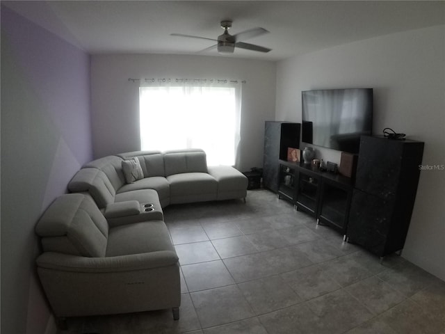 living room featuring light tile flooring and ceiling fan