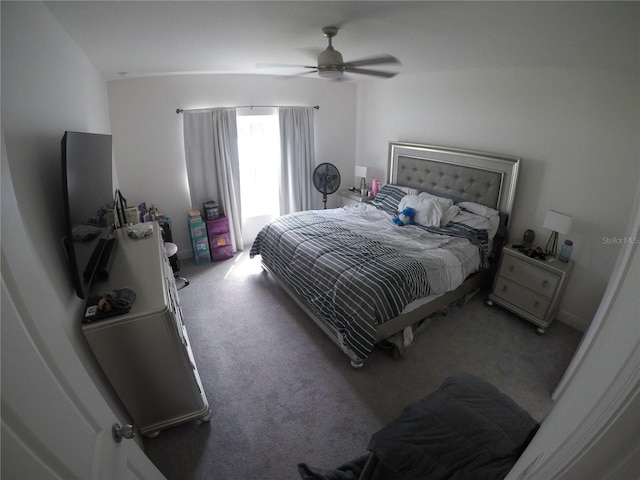 bedroom featuring lofted ceiling, carpet flooring, and ceiling fan