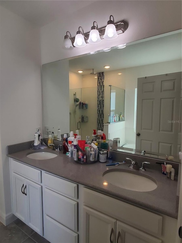 bathroom with double vanity and tile floors