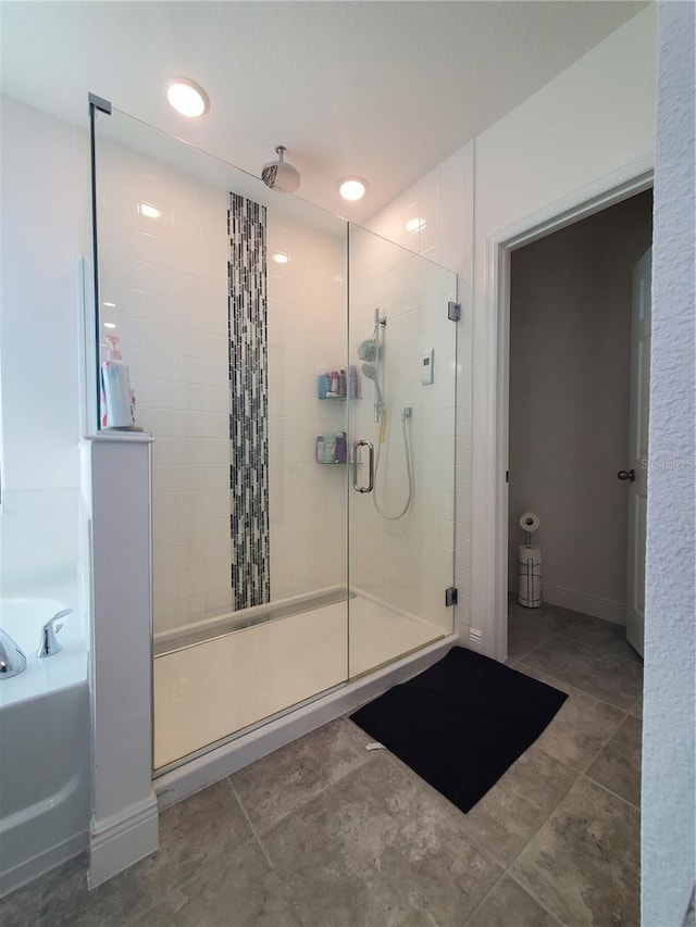 bathroom with plus walk in shower and tile floors