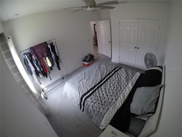 bedroom with carpet floors, a closet, and ceiling fan