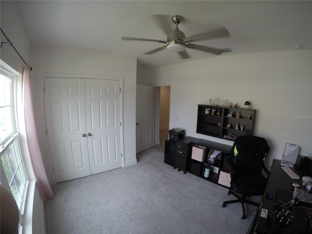 carpeted office featuring ceiling fan