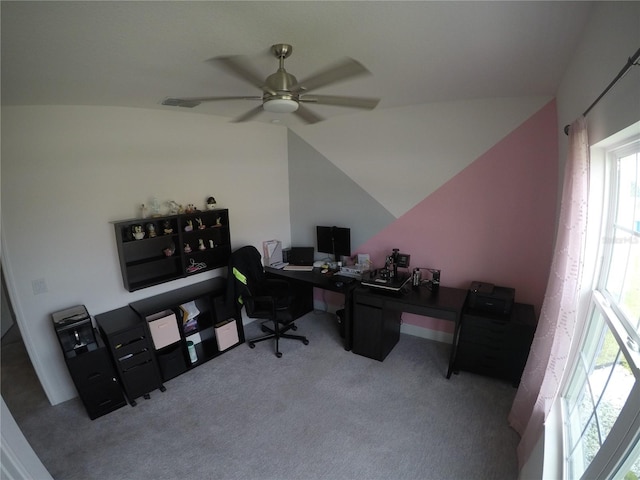 carpeted office with vaulted ceiling and ceiling fan