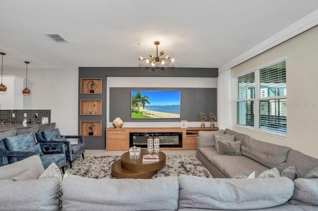 living room featuring a notable chandelier