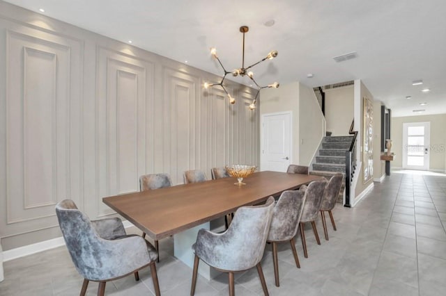 tiled dining area with a notable chandelier