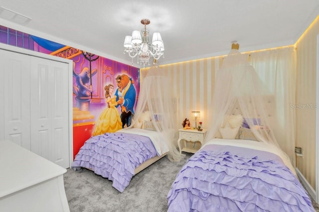 bedroom featuring light colored carpet, a closet, and a notable chandelier