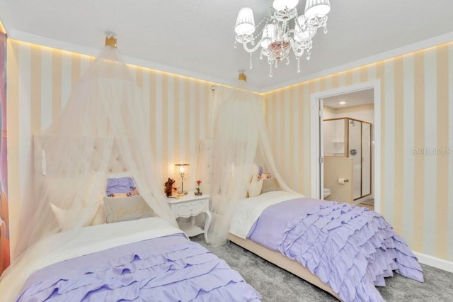 bedroom featuring an inviting chandelier, ensuite bathroom, and light colored carpet